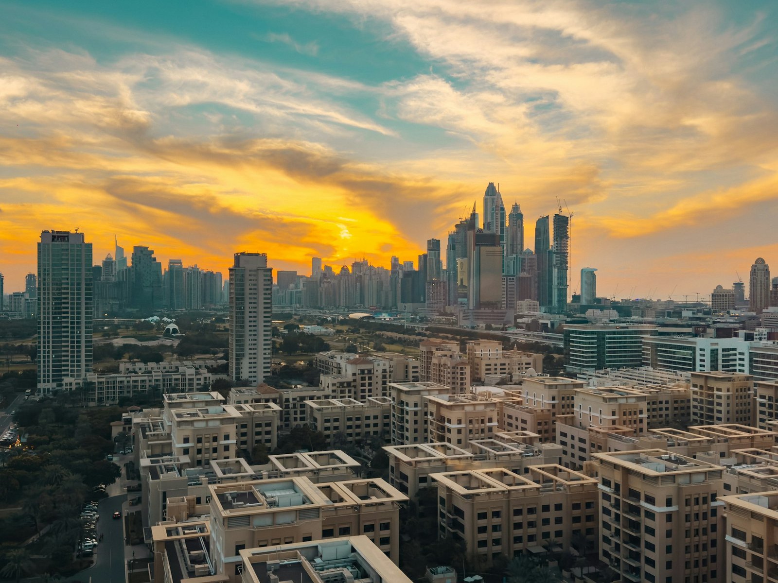 Dubai skyline at sunset with high-rise buildings